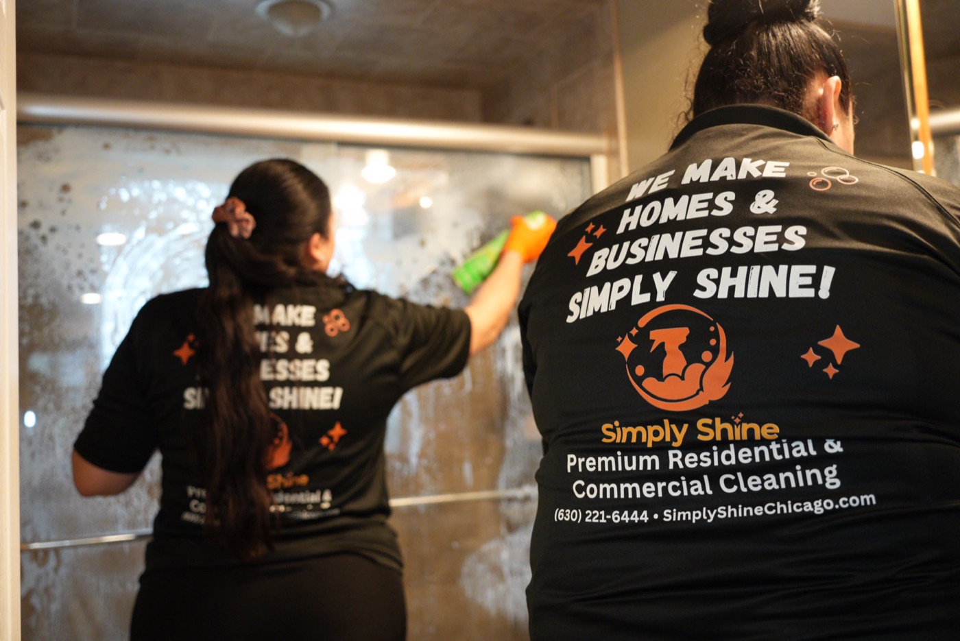 Simply Shine team cleaning shower glass